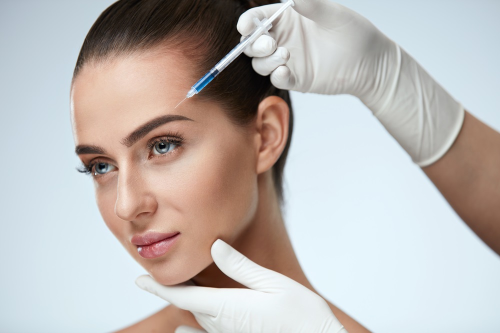 Beauty Face. Beautiful Woman Getting Facial Lifting Injections by MilfordMD in Richard Buckley, MD